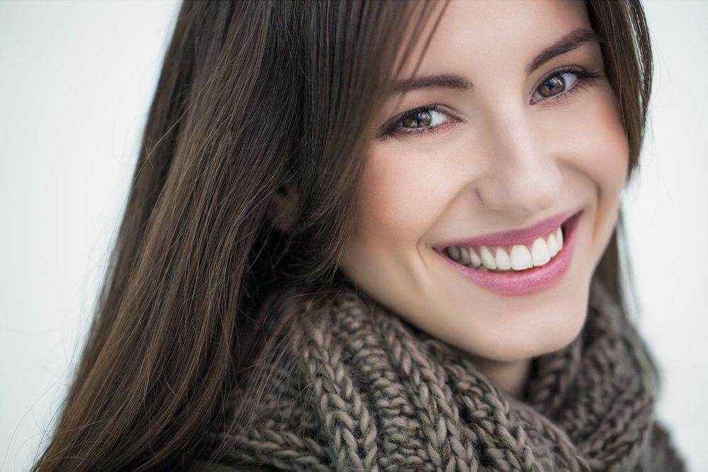 Woman smiling with straight, white teeth